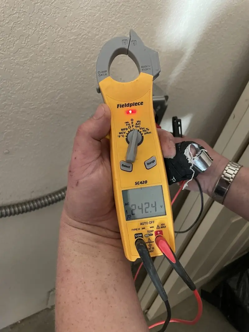 Voltage testing with clamp meter during Generator Installation in Nokomis